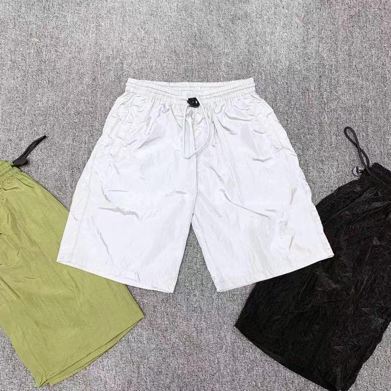 Fashion Brand designer pleated light men's shorts in nylon with drawstring closure, perfect for casual and sporty occasions.