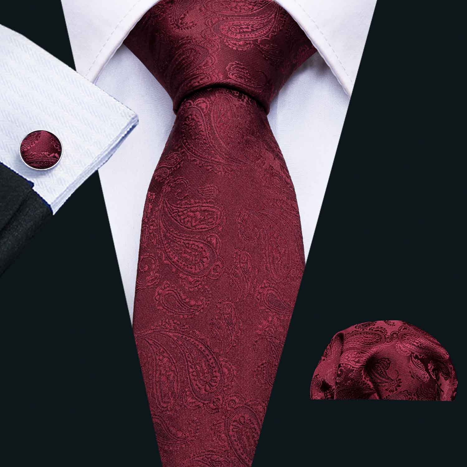 Wine red paisley polyester jacquard woven tie with matching cufflinks and hanky set, elegantly displayed.