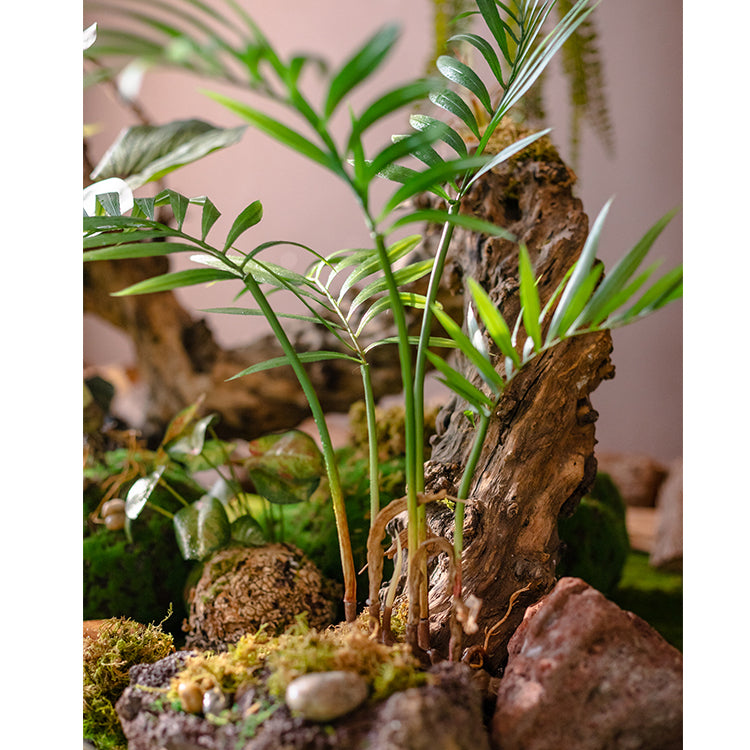 A 23-inch tall faux Murdannia plant with realistic green leaves and roots, perfect for home decor.