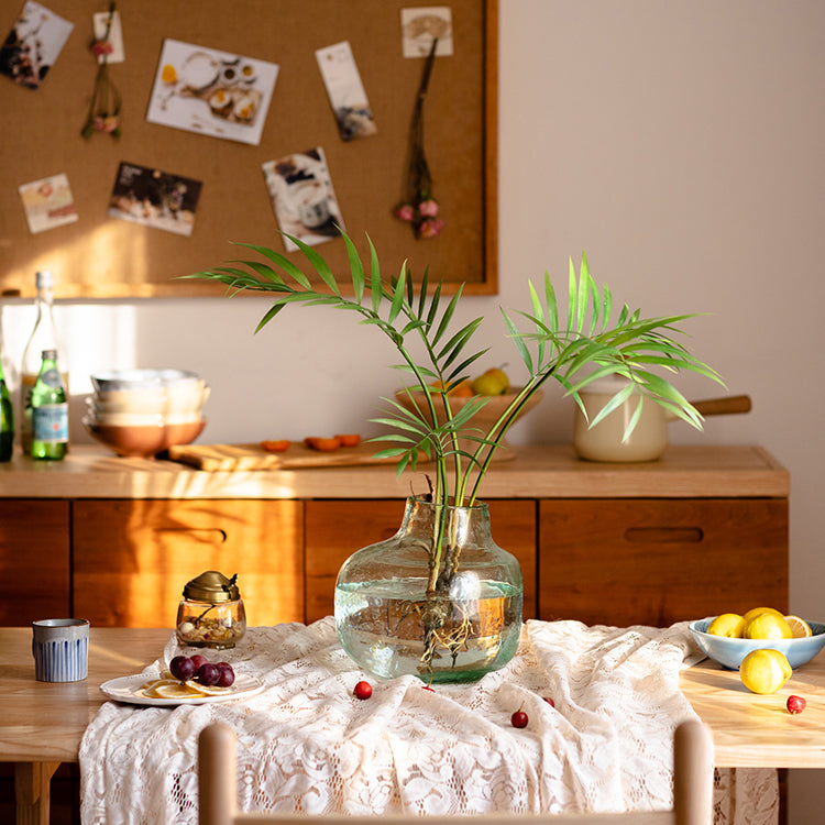 A 23-inch tall faux Murdannia plant with realistic green leaves and roots, perfect for home decor.