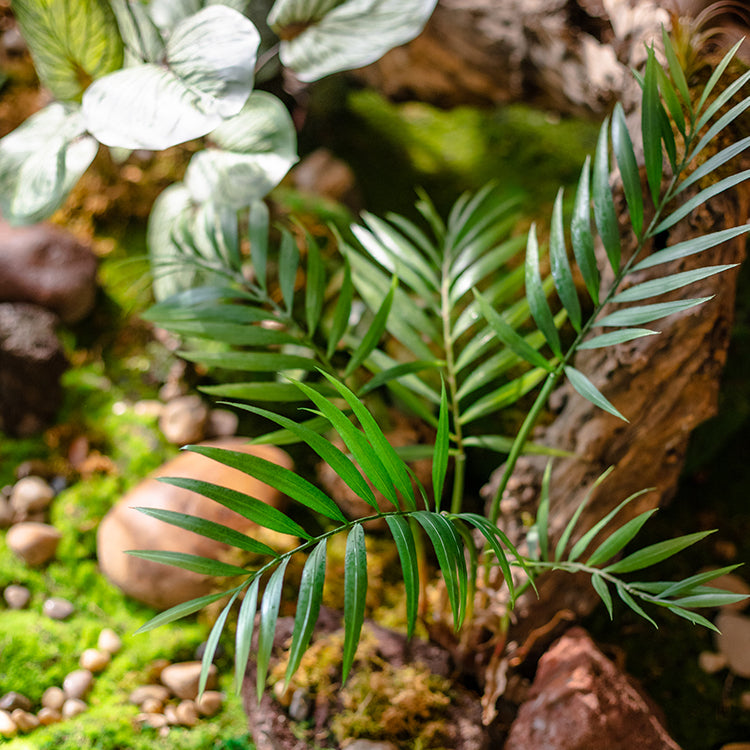 A 23-inch tall faux Murdannia plant with realistic green leaves and roots, perfect for home decor.