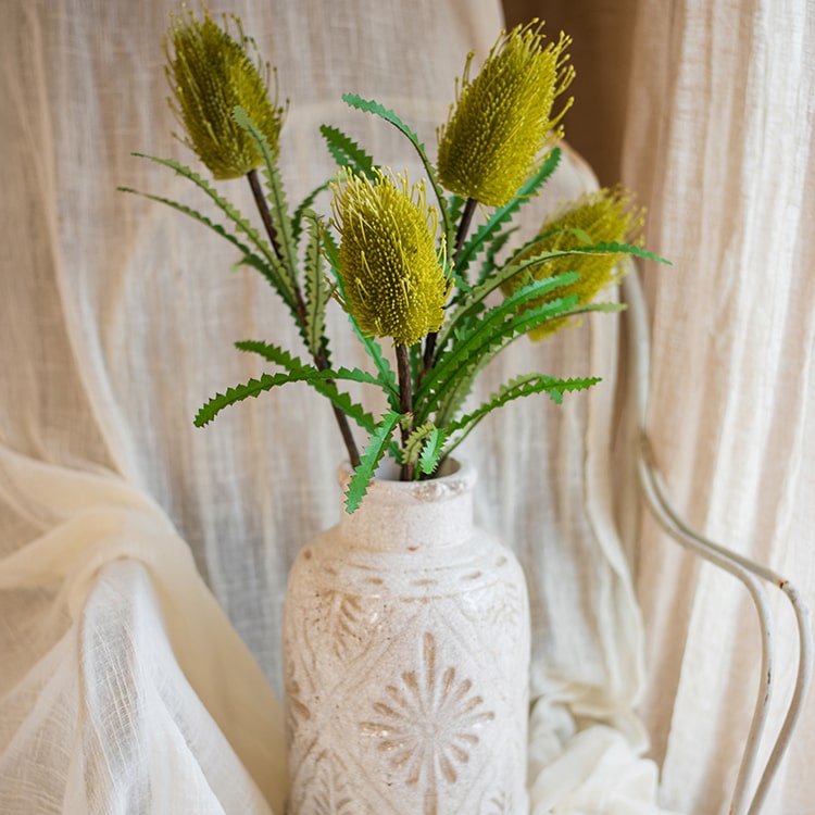 28-inch tall Faux Banksia Integrifolia silk flower with vibrant red and yellow blooms and green leaves, perfect for floral arrangements.