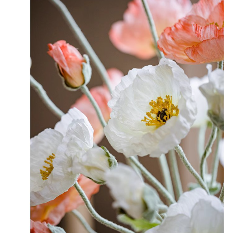 A tall 41-inch faux silk poppy flower stem in vibrant pink, red, and white colors with lush green leaves, perfect for home decor.