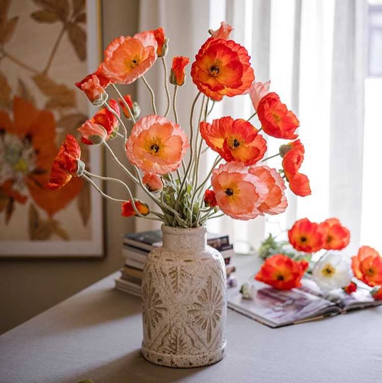 A tall 41-inch faux silk poppy flower stem in vibrant pink, red, and white colors with lush green leaves, perfect for home decor.