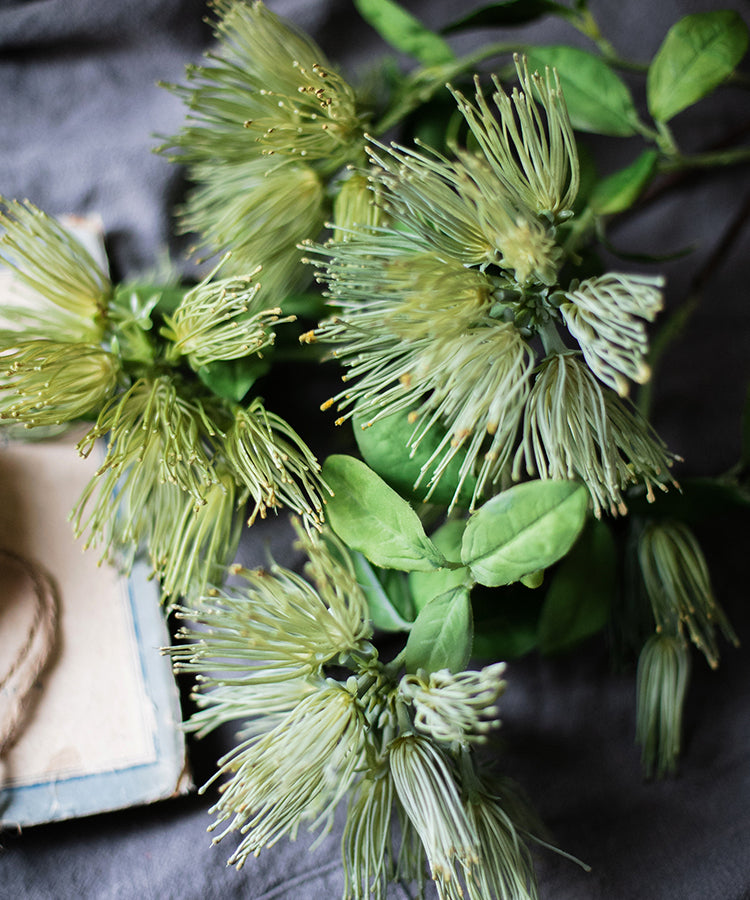 A 25-inch tall Faux Silk Artificial Albizia Flower Stem with three vibrant blooms and a green stem, perfect for home decor.