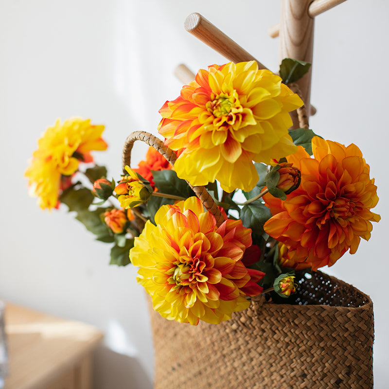 A 29-inch tall faux silk artificial blooming dahlia stem with vibrant petals in black purple, orange, and yellow colors, showcasing realistic details.