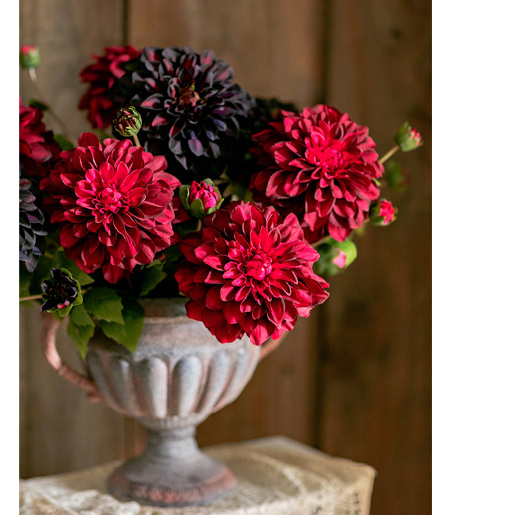 A 29-inch tall faux silk artificial blooming dahlia stem with vibrant petals in black purple, orange, and yellow colors, showcasing realistic details.