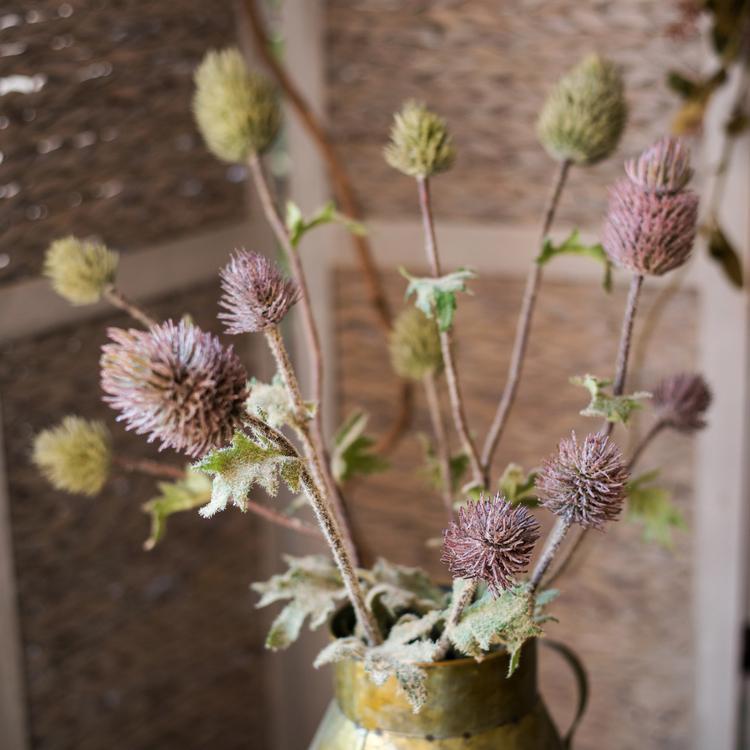 A 26-inch tall faux silk artificial thistle flower stem with three blooms in blue, green, and red, showcasing realistic petals and elegant design.