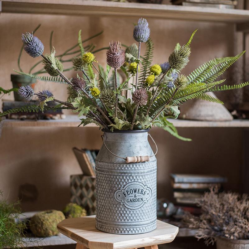 A 26-inch tall faux silk artificial thistle flower stem with three blooms in blue, green, and red, showcasing realistic petals and elegant design.