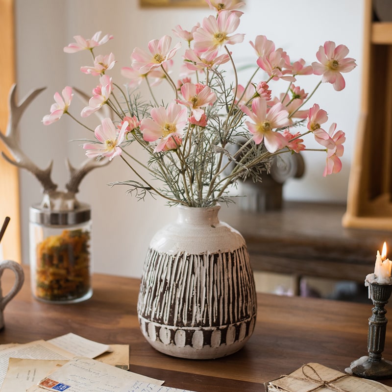 A 24-inch tall Faux Silk Cosmos Stem in Light Pink, showcasing delicate petals and a realistic design, perfect for home decor.