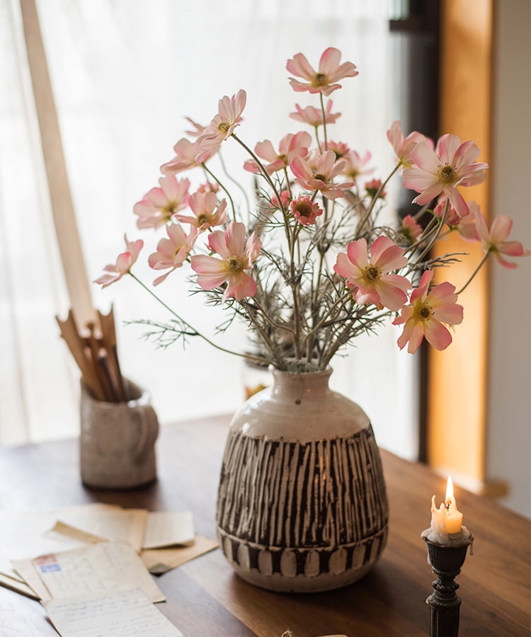 A 24-inch tall Faux Silk Cosmos Stem in Light Pink, showcasing delicate petals and a realistic design, perfect for home decor.