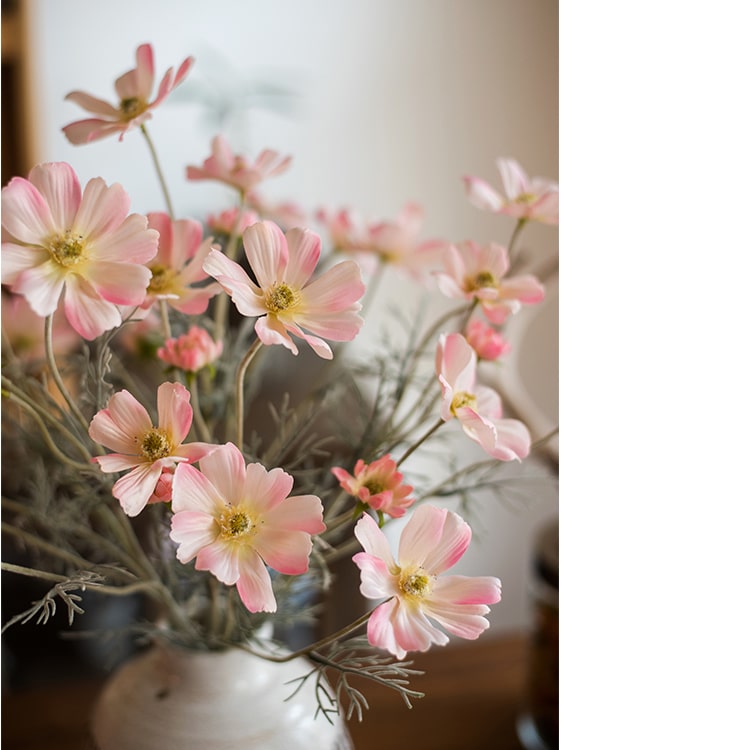 A 24-inch tall Faux Silk Cosmos Stem in Light Pink, showcasing delicate petals and a realistic design, perfect for home decor.