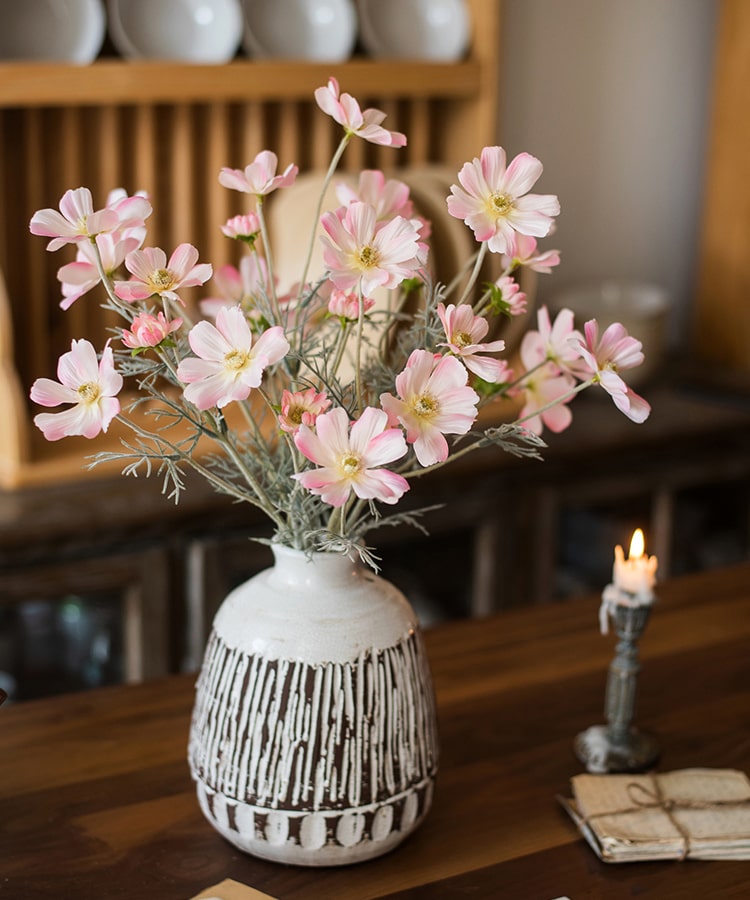 A 24-inch tall Faux Silk Cosmos Stem in Light Pink, showcasing delicate petals and a realistic design, perfect for home decor.