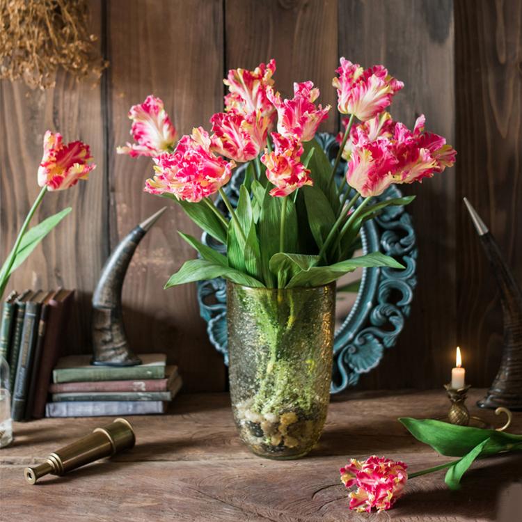 A vibrant 24-inch tall faux silk Flame Tulip stem featuring pink and red petals with green leaves, ideal for home decor.