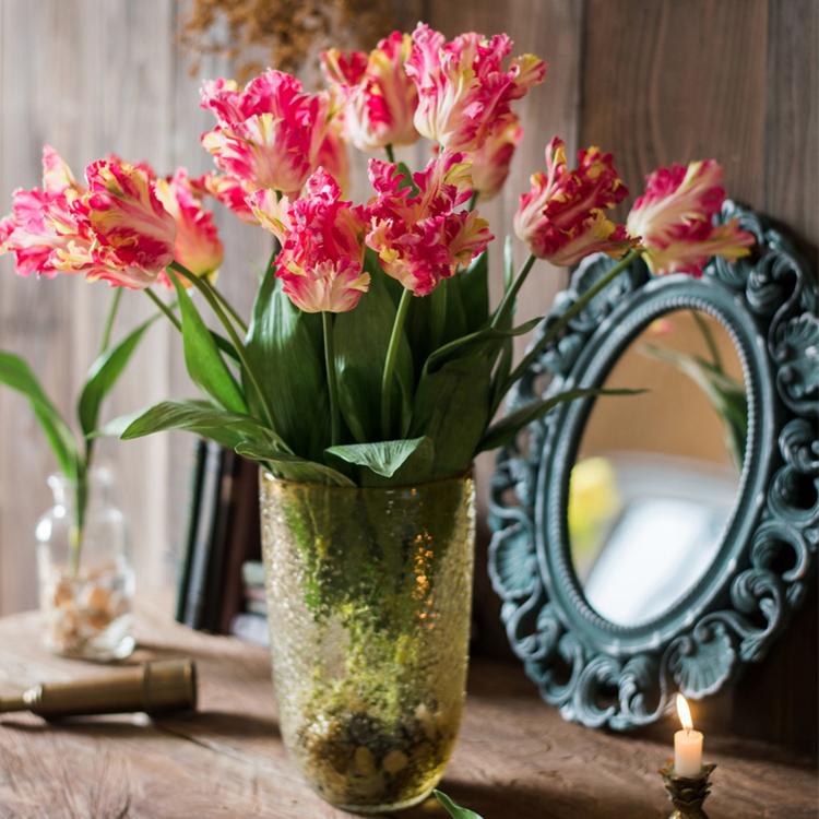 A vibrant 24-inch tall faux silk Flame Tulip stem featuring pink and red petals with green leaves, ideal for home decor.