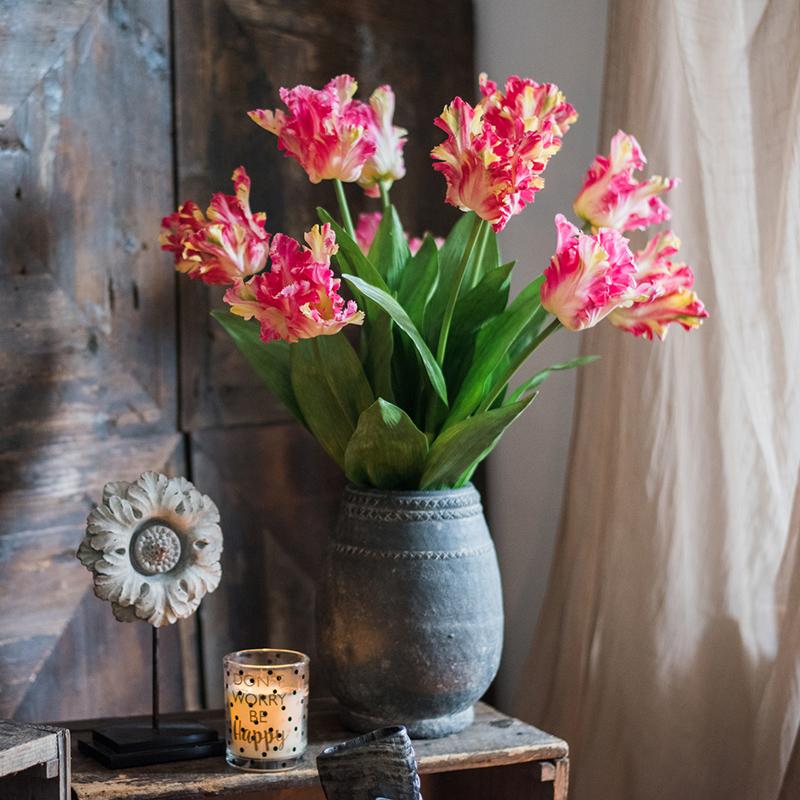 A vibrant 24-inch tall faux silk Flame Tulip stem featuring pink and red petals with green leaves, ideal for home decor.