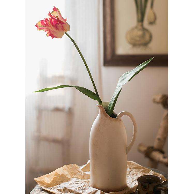 A vibrant 24-inch tall faux silk Flame Tulip stem featuring pink and red petals with green leaves, ideal for home decor.