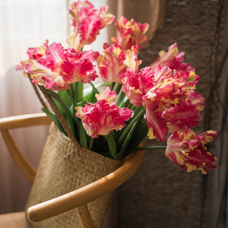 A vibrant 24-inch tall faux silk Flame Tulip stem featuring pink and red petals with green leaves, ideal for home decor.