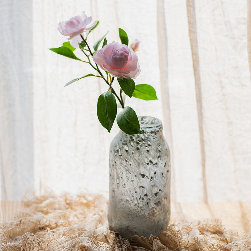 22-inch tall Faux Silk Gardenia Flower Stem with pink and white blooms and green leaves, perfect for home decor.