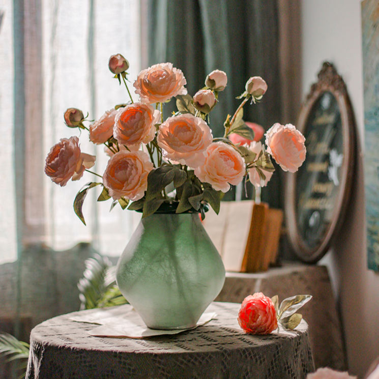 A 27.5-inch tall faux silk peony stem featuring two vibrant blooms and one bud, available in champagne, pink, red, and white colors.