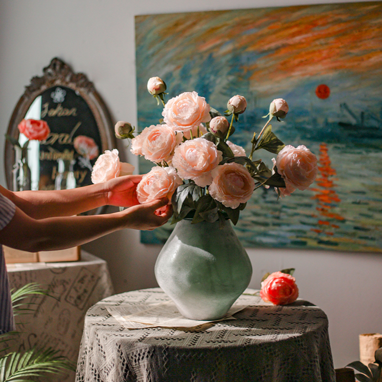 A 27.5-inch tall faux silk peony stem featuring two vibrant blooms and one bud, available in champagne, pink, red, and white colors.