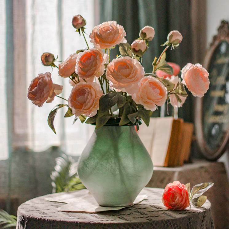 A 27.5-inch tall faux silk peony stem featuring two vibrant blooms and one bud, available in champagne, pink, red, and white colors.