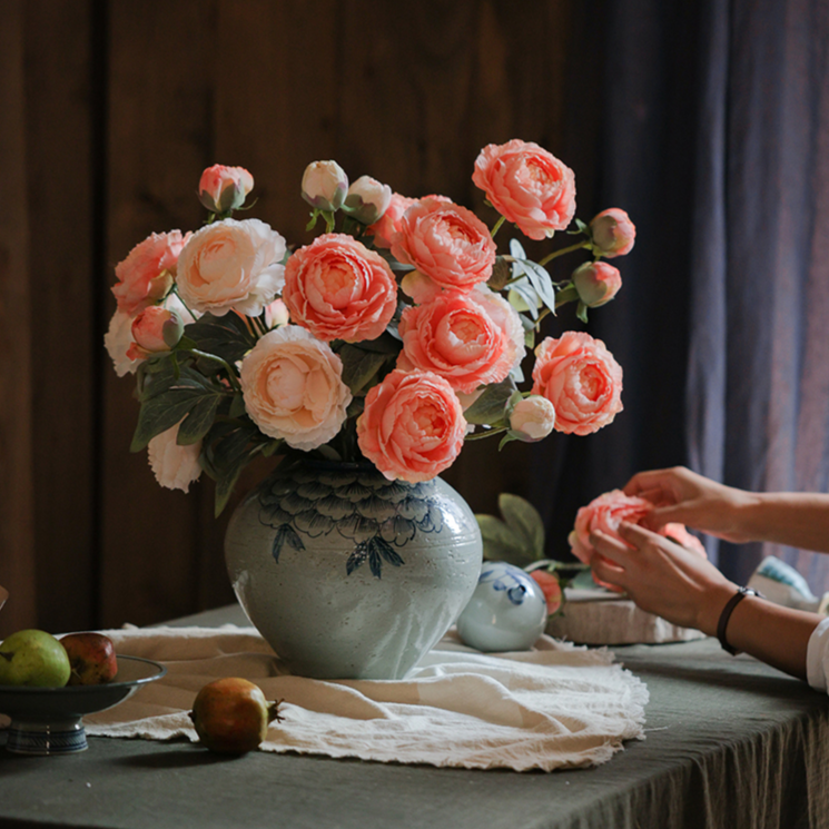 A 27.5-inch tall faux silk peony stem featuring two vibrant blooms and one bud, available in champagne, pink, red, and white colors.