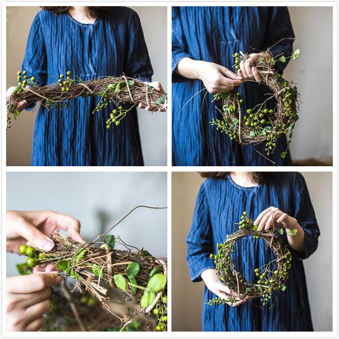 A beautifully crafted faux berry wreath made from natural rattan willow, featuring vibrant red and green artificial berries, perfect for home decor.