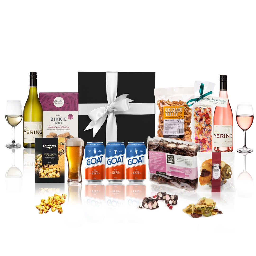 Festive Celebration Hamper featuring gourmet snacks and fine wines in a black box with a white satin bow.