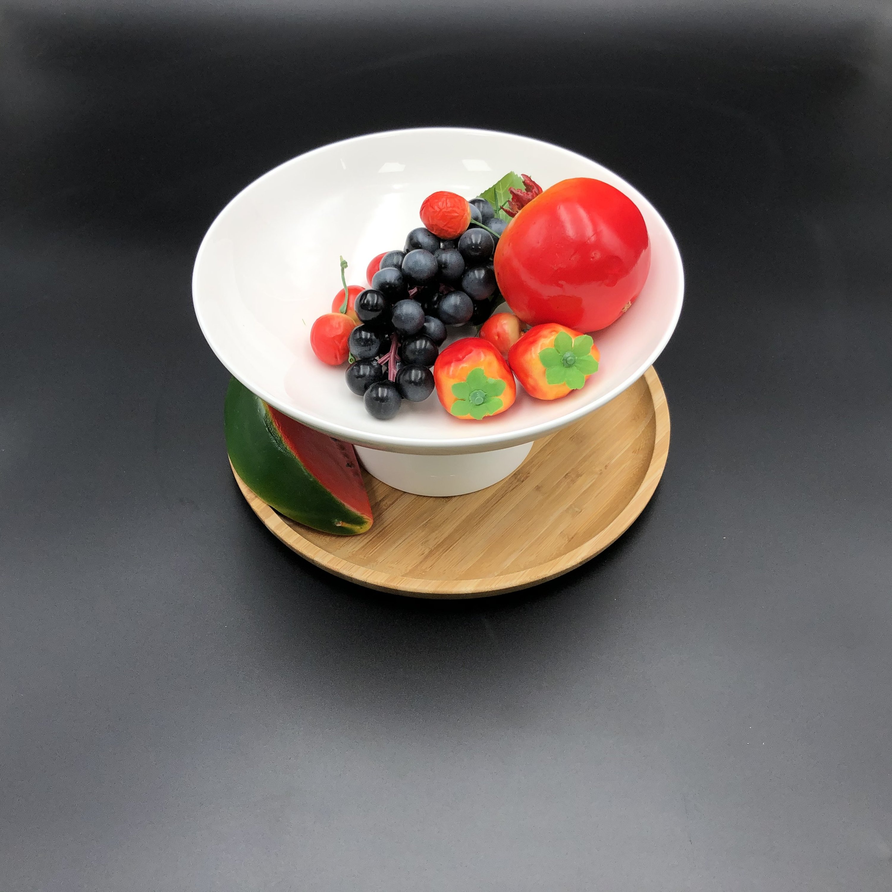 Fine porcelain fruit vase with a 10 inch bamboo tray, elegantly showcasing fruits and desserts.