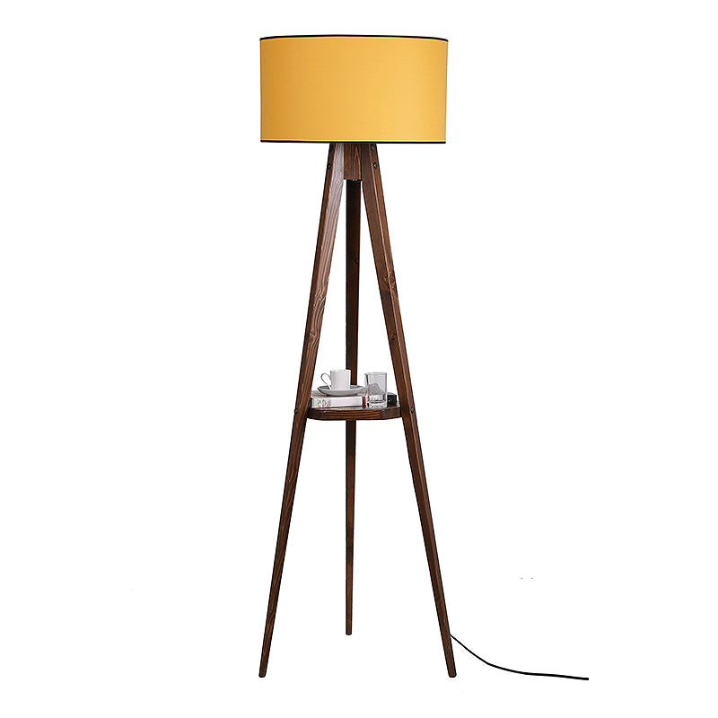 Floor Lamp ANIKE in walnut and mustard color, featuring a fabric shade and a wooden base with a shelf.