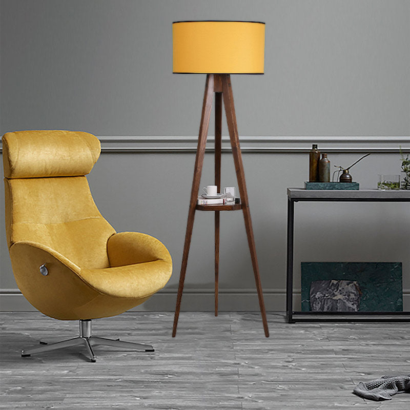 Floor Lamp ANIKE in walnut and mustard color, featuring a fabric shade and a wooden base with a shelf.