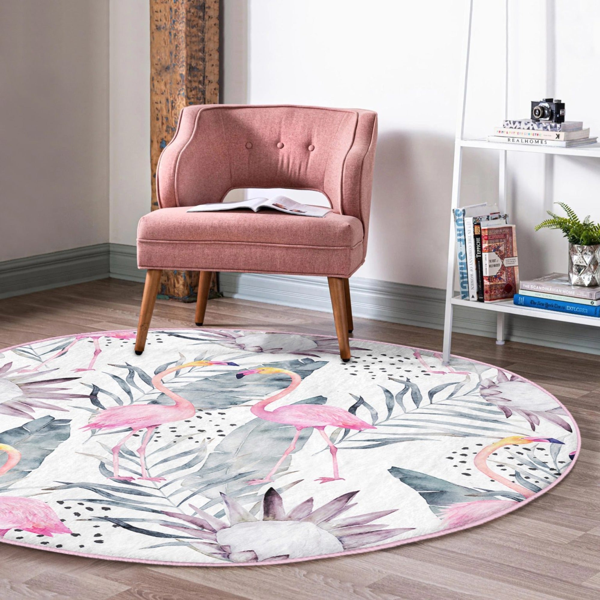 A vibrant round rug featuring a floral and flamingo pattern, perfect for living room decor.