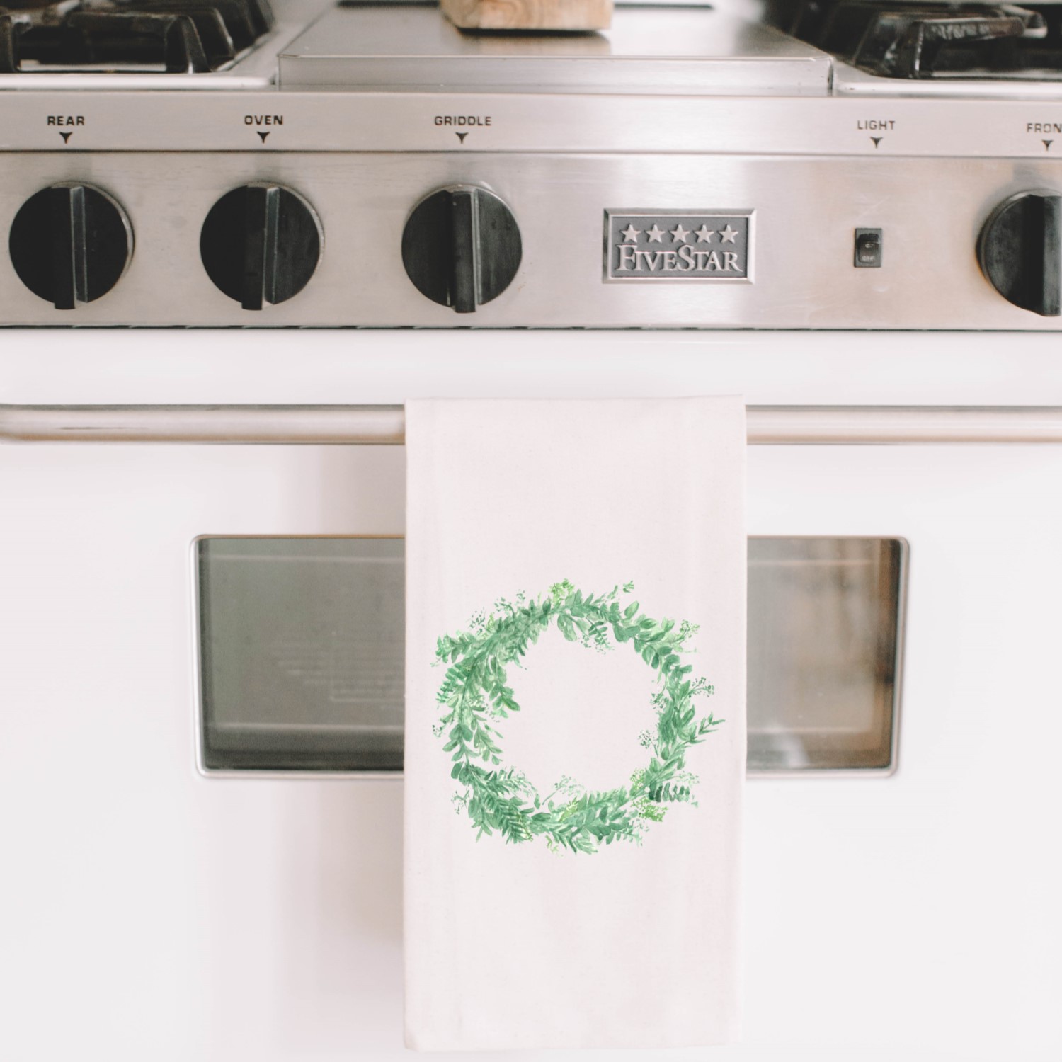 Floral Wreath Tea Towel featuring elegant calligraphy design by Alyssa Thiel, made from 100% organic cotton in white and natural colors.