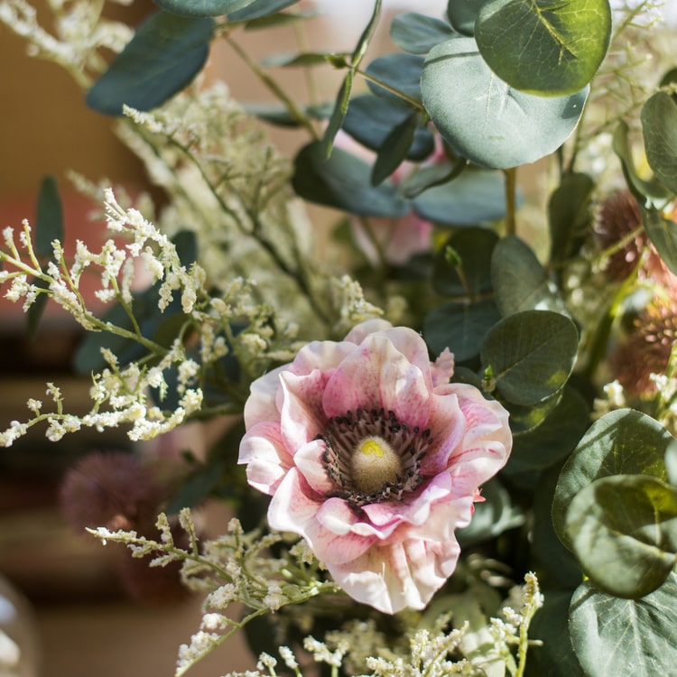 A beautiful handmade artificial flower bouquet featuring pink anemones and green eucalyptus, standing 21 inches tall.