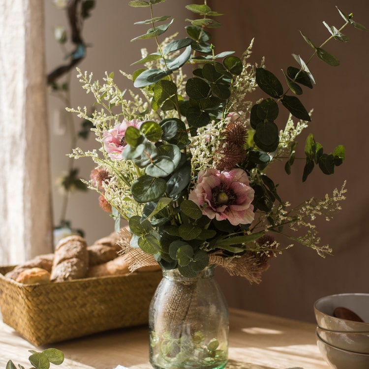 A beautiful handmade artificial flower bouquet featuring pink anemones and green eucalyptus, standing 21 inches tall.