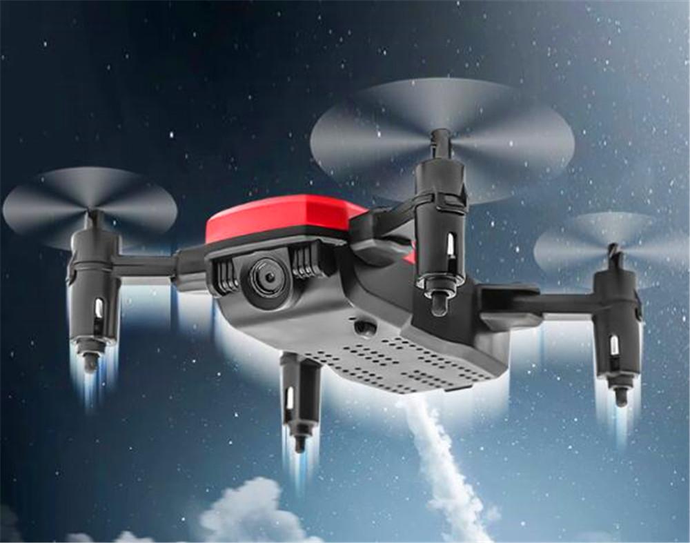 Foldable Mini Drone with HD camera in flight, showcasing its compact design and advanced features.