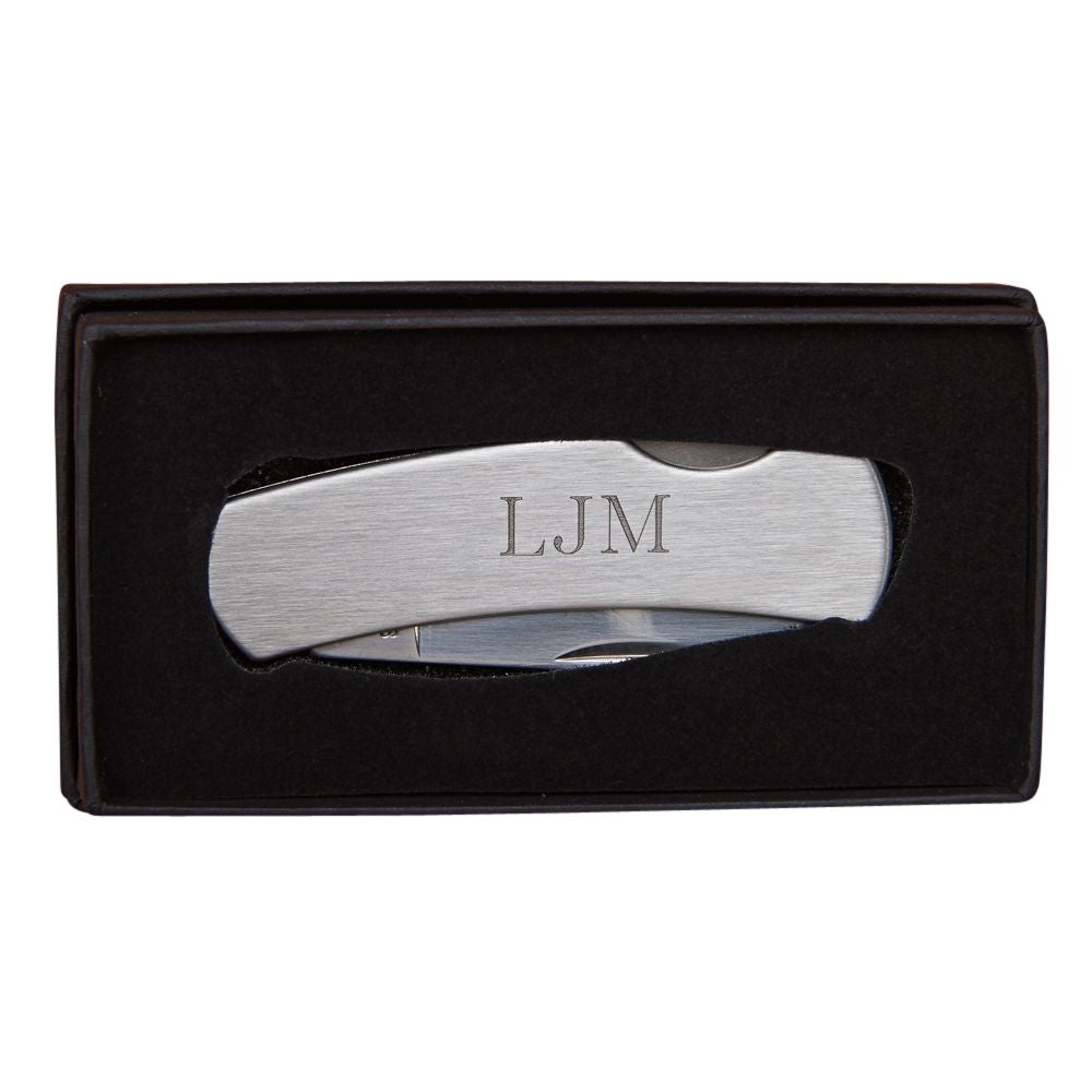 A stainless steel folding locking pocket knife with a smooth finish, showcasing its blade and locking mechanism, ideal for engraving.