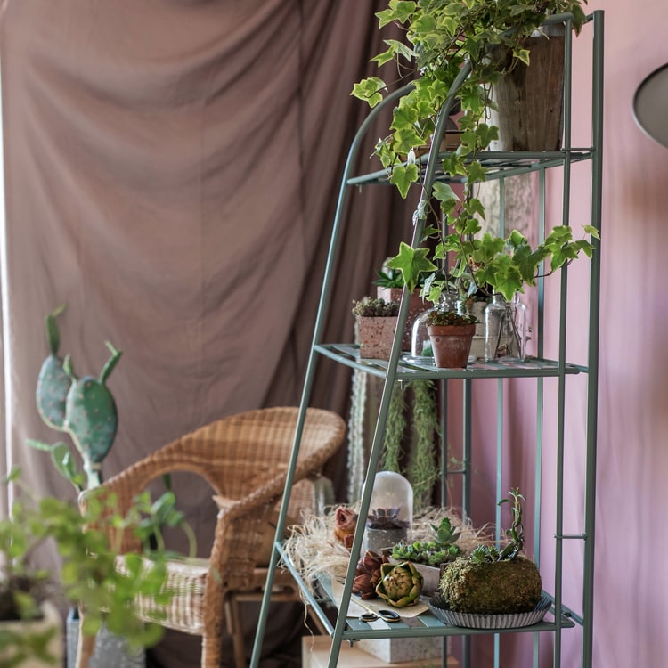 Four Tire Foldable Metal Shelf in green and blue, showcasing its stylish design and four-tier structure.