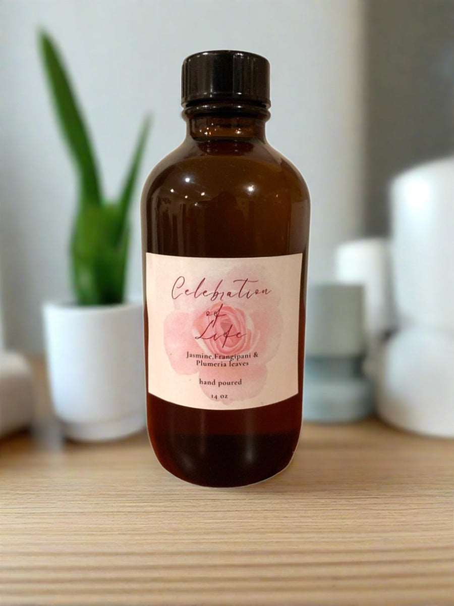 A bottle of Fragrance Burning Oil with a diffuser and aromatic herbs, showcasing its natural ingredients and inviting scent.