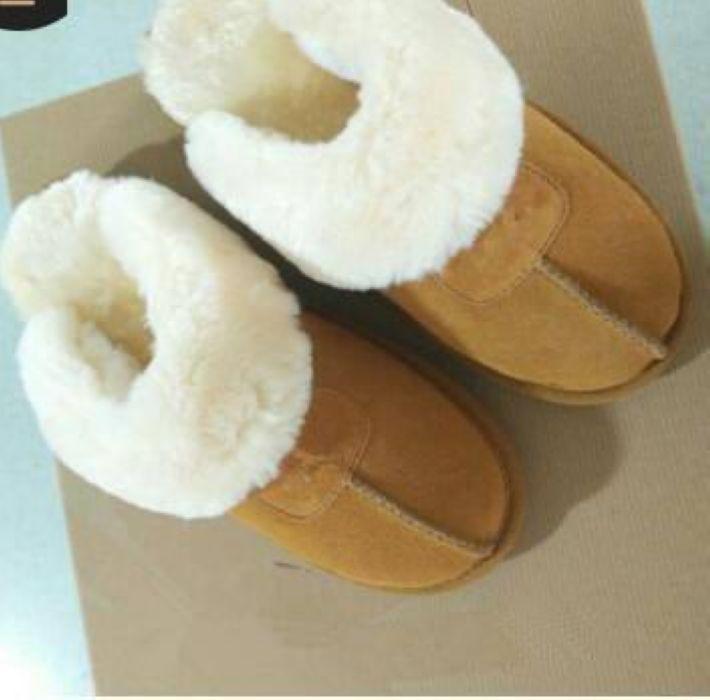 High-quality WGG Warm cotton slippers for men, featuring a stylish half-boot design in genuine leather and plush lining for ultimate comfort.