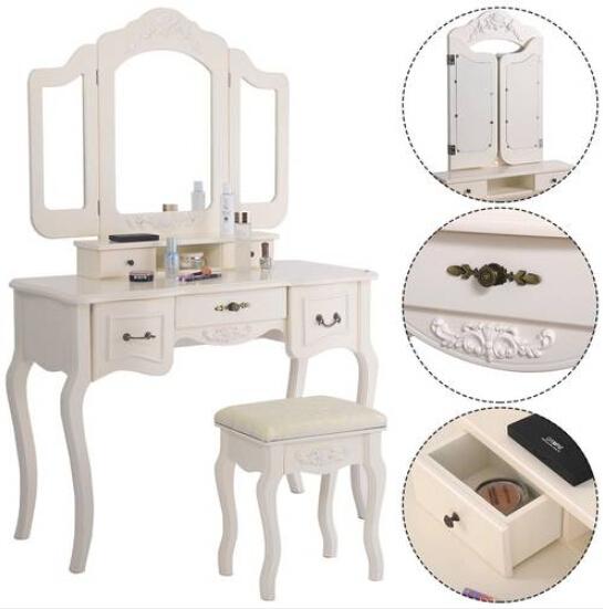 Elegant white tri-fold mirror dresser with dressing stool, featuring three mirrors and five drawers.