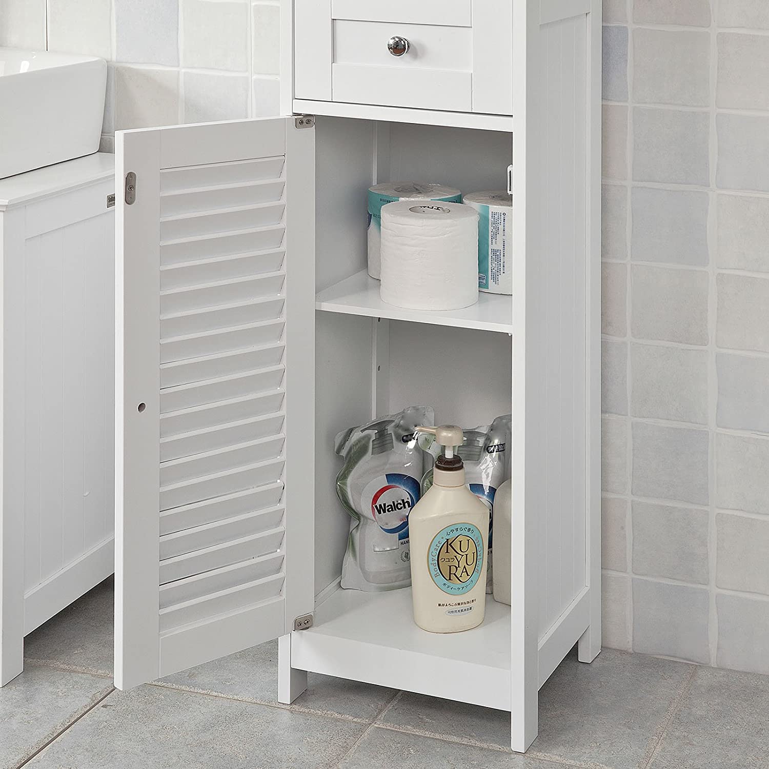 Freestanding Tall Bathroom Cabinet in white with two shutter doors and a drawer, showcasing adjustable shelves inside.