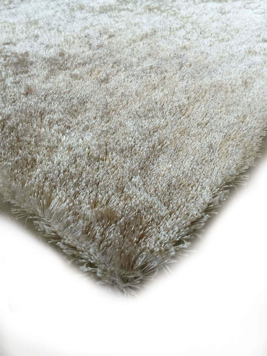 Fuzzy Beige Area Rug showcasing a soft shaggy texture, perfect for home decor.