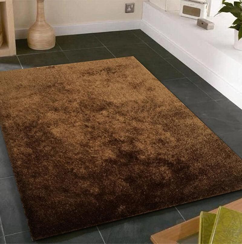 Fuzzy Brown Area Rug showcasing a soft shaggy texture, perfect for enhancing home decor with warmth and comfort.