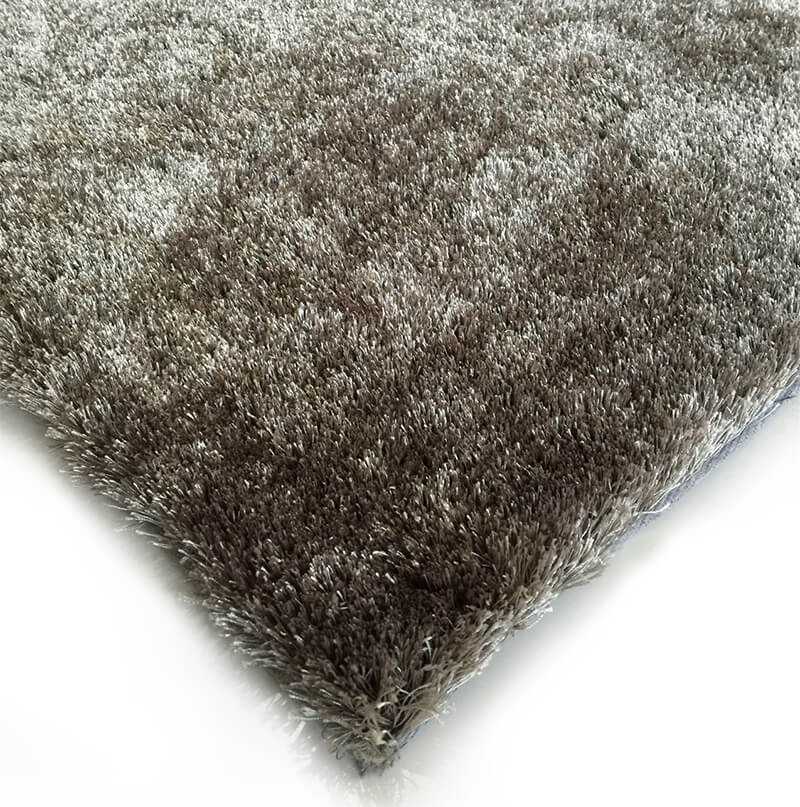 Fuzzy Silver Area Rug showcasing a soft shaggy texture in a stylish silver color, perfect for home decor.