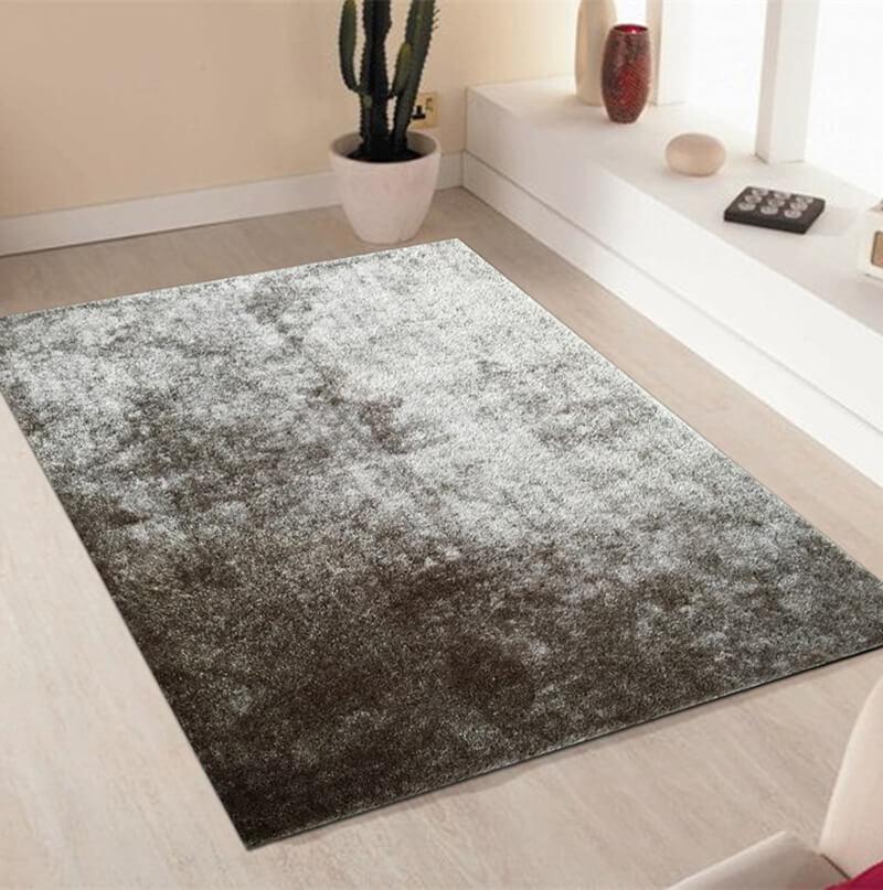 Fuzzy Silver Area Rug showcasing a soft shaggy texture in a stylish silver color, perfect for home decor.