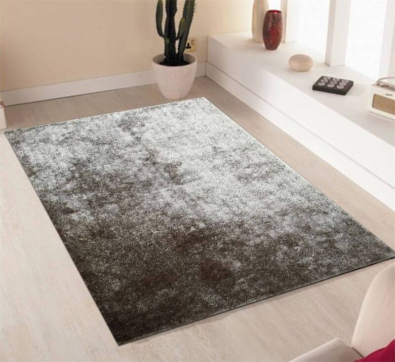 Fuzzy Silver Area Rug showcasing a soft shaggy texture in a stylish silver color, perfect for home decor.