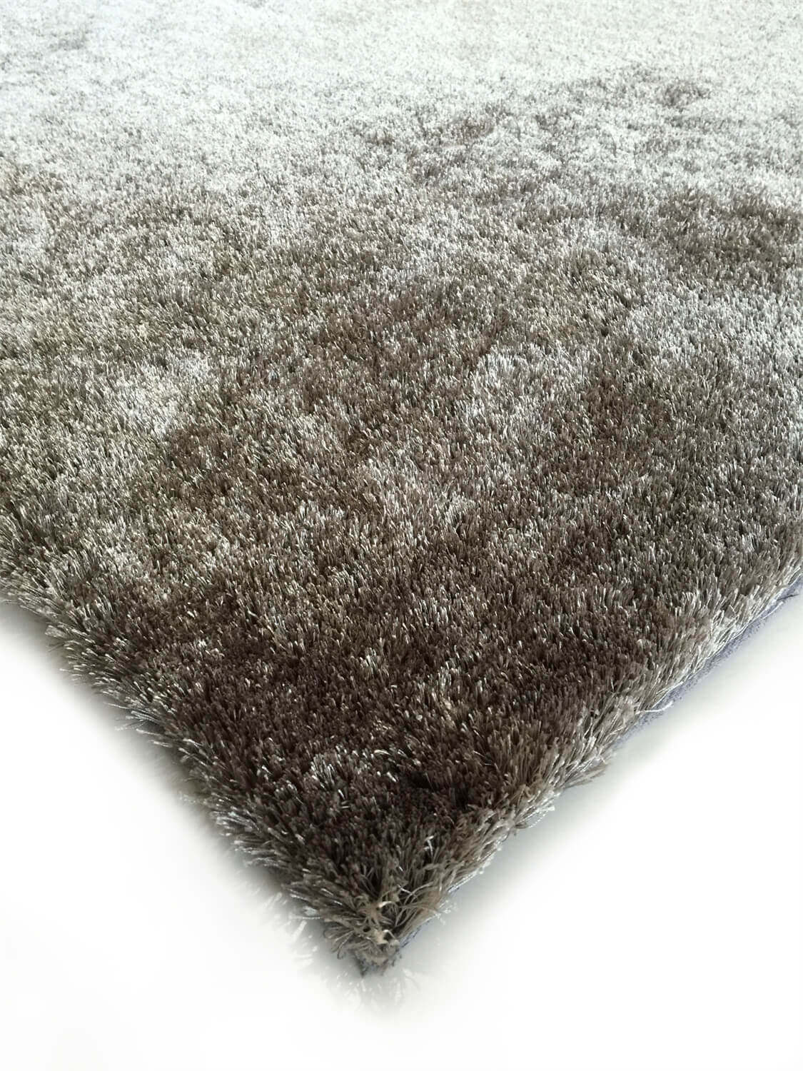 Fuzzy Silver Area Rug showcasing a soft shaggy texture in a stylish silver color, perfect for home decor.