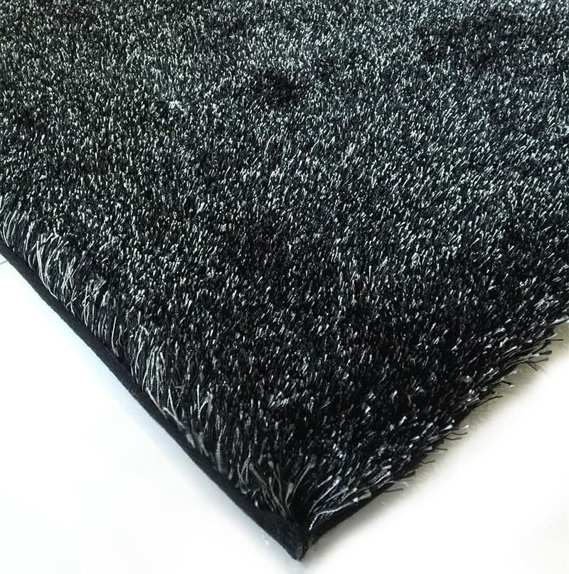 Fuzzy Two Tone Black Ash Area Rug showcasing a soft shaggy texture in black and rust colors, perfect for enhancing home decor.